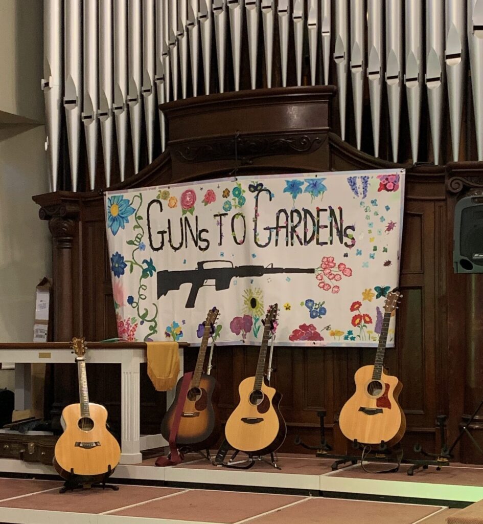 Poster and guitars at SPC PeaceFest