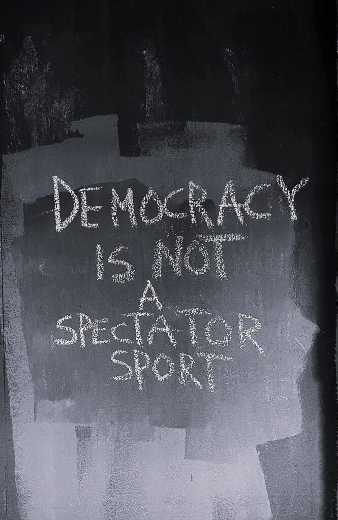 Text on photo:  Democracy is not a spectator sport
